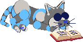 Zane, a robot cat, sleeping next to an open book